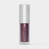 Transparente Tube Sparkl von LH Cosmetics mit weißer Kappe und lila schimmerndem Farbton namens Magic.