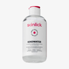 Eine durchsichtige Flasche Skinlick Kindwater Mizellenlösung, 250ml, mit weißem und rosa Etikett und schwarzem Flip-Top-Verschluss.
