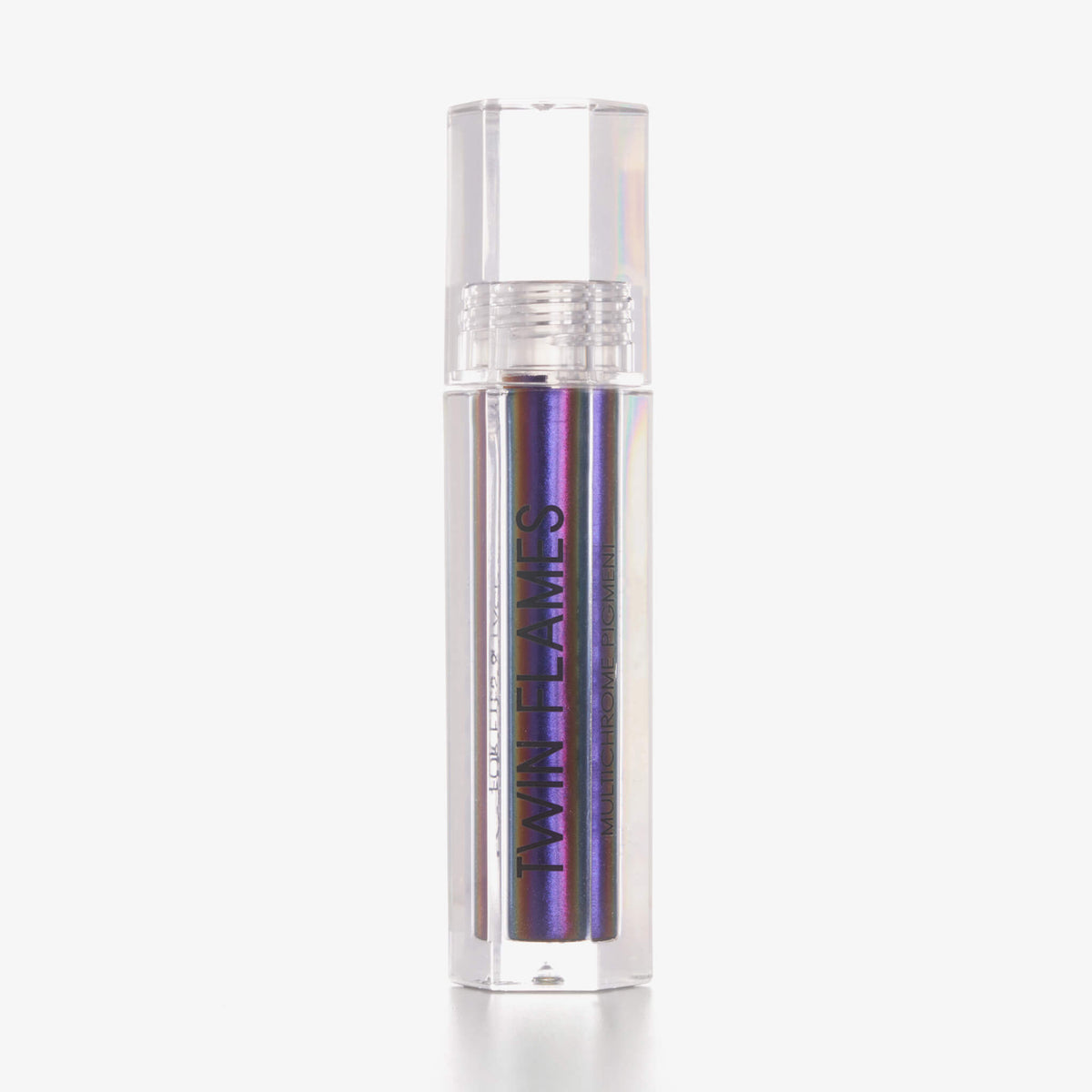 Eine durchsichtige Tube Twin Flames Adore U mit lila schimmerndem Inhalt vor weißem Hintergrund.