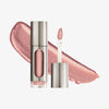 Eine teils silberne und teils transparente Tube Vision Flush Glow Electric Love mit Rosé schimmerndem Inhalt vor weißem Hintergrund.