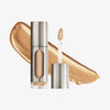 Eine teils silberne und teils transparente Tube Vision Flush Glow Tiara mit gold schimmerndem Inhalt vor weißem Hintergrund.