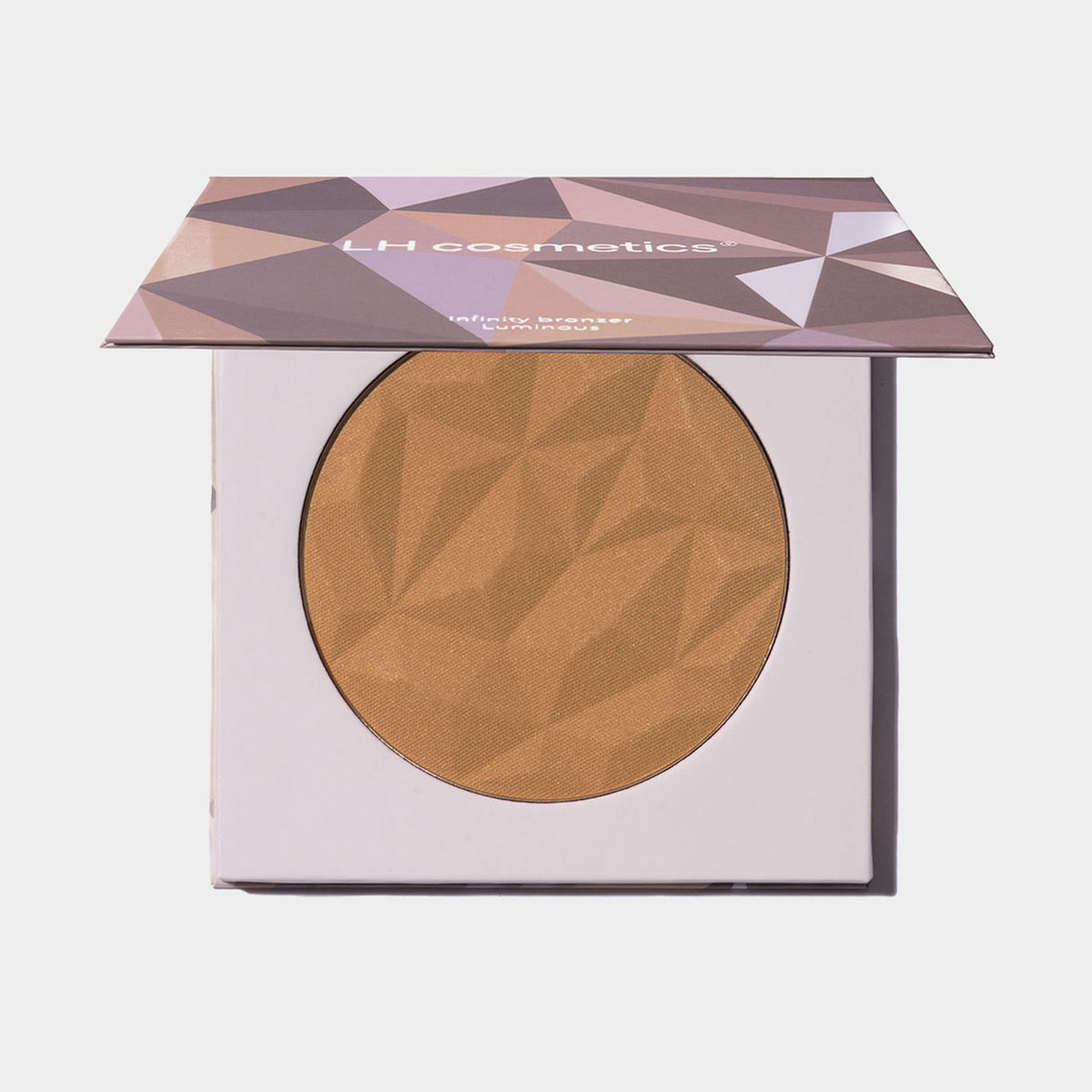 Eckige Kompaktdose mit geometrischem lilanem Muster und orange-braunem Puder des Infinity Bronzer Beyond von LH Cosmetics vor weißem Hintergrund.
