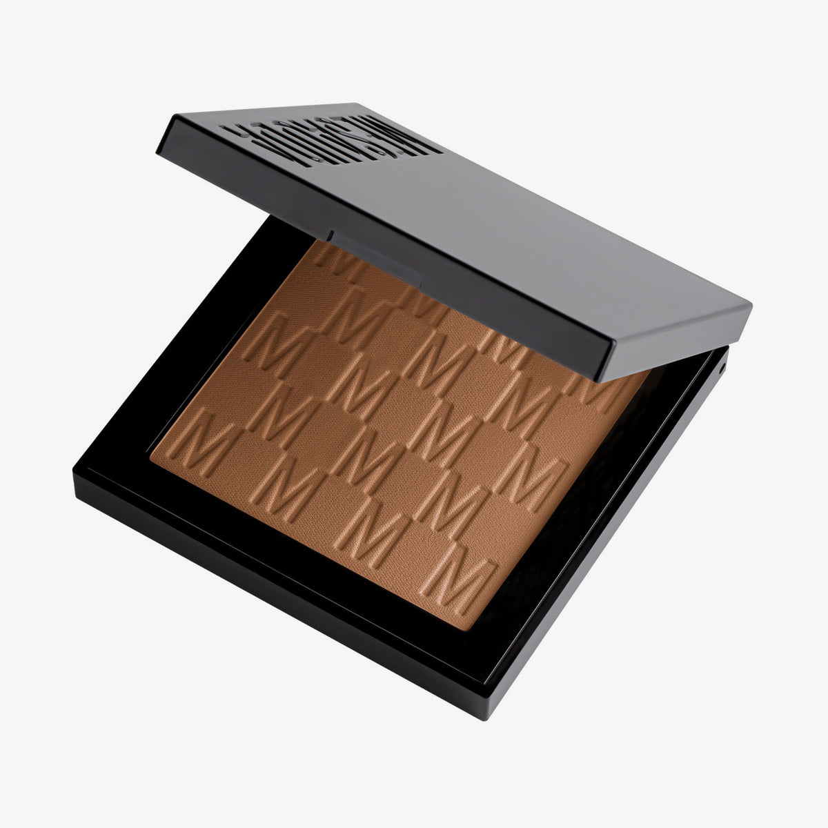 Der halb-geöffnete Bronzer Bronze Venus von Mesauda Beauty in einer quadratischen Produktschale und eingeprägtem M-Muster.
