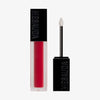 Der Sublimatte Matte Liquid Lipstick von Mesauda Beauty in einer rechteckigen Tube mit dem Deckel und Applikator daneben.