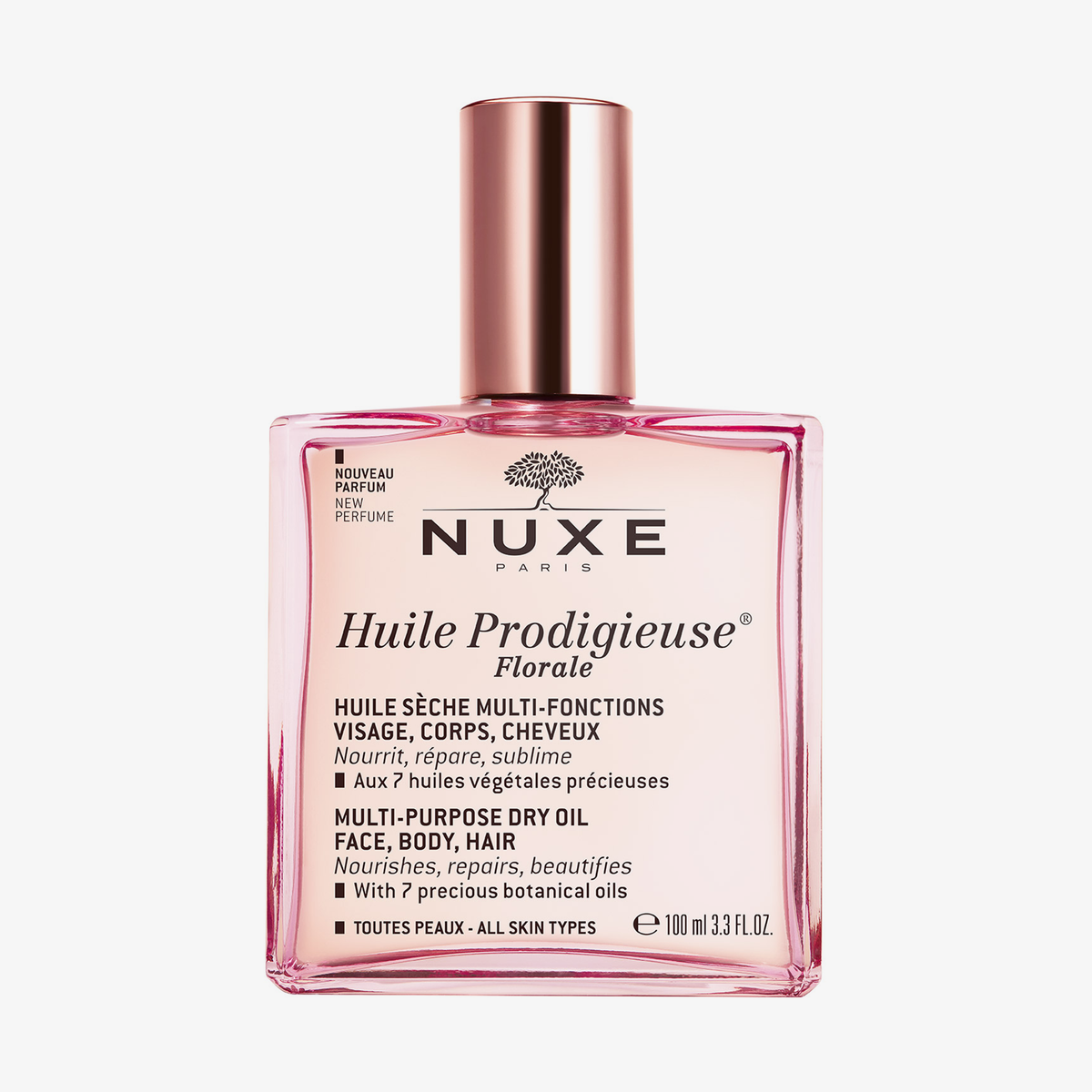Rosa Glasflasche NUXE Huile Prodigieuse® Florale in 100ml und Metallverschluss auf weißem Hintegrund.