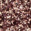 Nahaufnahme von funkelnden, metallischen Roségold/Bronze partikeln aus der Glorious Lights Glitter Palette, die zusammen gruppiert sind.