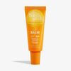 Eine orangefarbene Tube Bondi Sands Lip Balm SPF 50+ Tropical Mango vor weißem Hintergrund