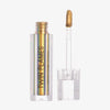 Eine offene durchsichtige Tube Twin Flames Obsession mit gold-grün-blau schimmerndem Inhalt vor weißem Hintergrund.