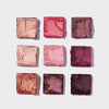 Neun Lidschattenquadrate in Rosa, Rot und neutralen Farbtönen aus der Blomma Palette, die in einem Raster auf weißem Hintergrund angeordnet sind.