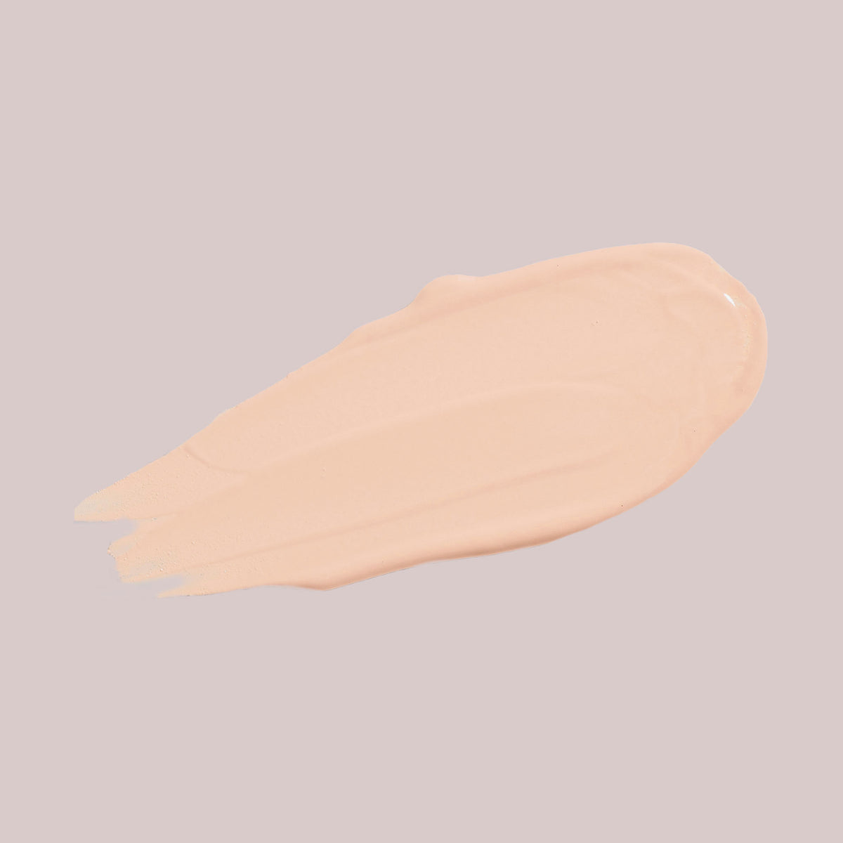 Ein Klecks Wide Awake Full Coverage Concealer Cream Brulee in Beige auf einem blassen Hintergrund.