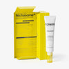 Eine Tube Acnemy Zitcontrol® mit geöffneter Verpackung vor weißem Hintergrund