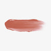 Ein Abstrich des Gloss Matrix Lipgloss von Mesauda Beauty auf einem weißen Hintergrund verschmiert.
