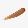 Cremiger Concealer-Swatch in einem warmen, mittleren Honigton – Nuance „Warm Honey“.