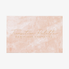Eine rosa marmorierte Transition-Palette von DOMINIQUE COSMETICS mit goldener Beschriftung.