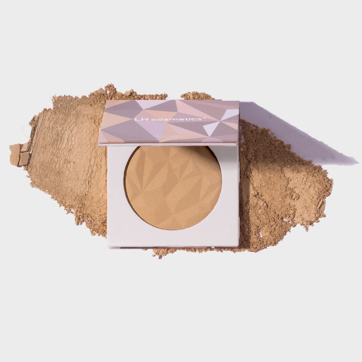Infinity Bronzer Always von LH Cosmetics auf losem beige-braunem Puder auf weißem Hintergrund.