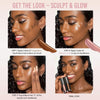 Eine Frau trägt Vision Flush Glow -Highlighter und Bronzer auf ihren Wangen auf und verblendet sie für einen strahlenden Look.