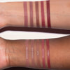 Zwei Unterarme in unterschiedlichen Hautfarben mit Farbmuster aller LH Cosmetics Crayon Lipliner Shades.
