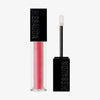 Der Gloss Matrix Lipgloss von Mesauda Beauty in einer rechteckigen Tube mit dem Deckel und Applikator daneben.
