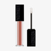 Der Gloss Matrix Lipgloss von Mesauda Beauty in einer rechteckigen Tube mit dem Deckel und Applikator daneben.
