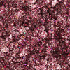 Nahaufnahme der Glorious Lights Glitter Palette mit funkelndem rosa und violettem Glitzer mit mehrfarbigen reflektierenden Partikeln.