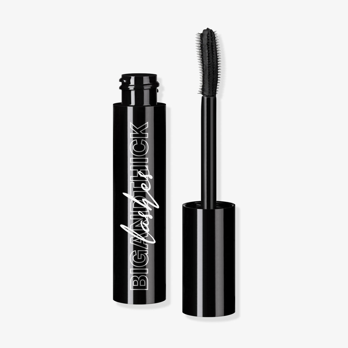 Eine offene schwarze Mesauda Beauty Big and Thick Lashes Mascara-Tube mit einem Applikator steht vor einem weißen Hintergrund.