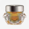 Transparenter Tiegel Infinite Chrome Flakes Fire Ball mit orange-blau schillerndem Inhalt und silbernem Deckel vor weißem Hintergrund.