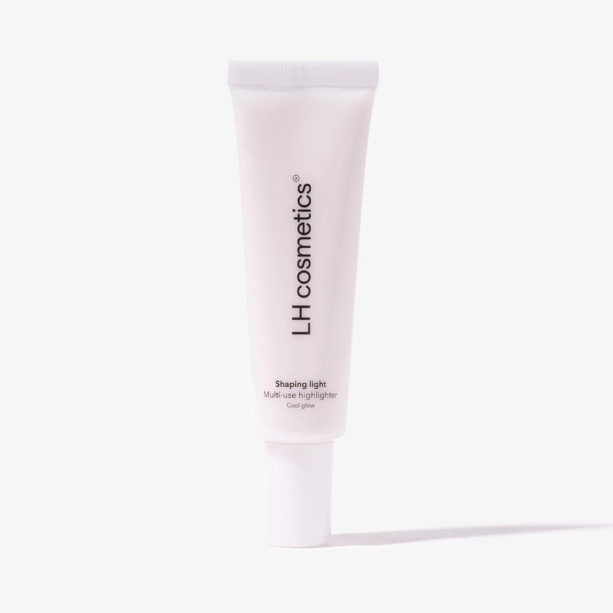 Eine Weiße Tube LH Cosmetics Shaping Light Cool Glow steht vor einem weißen Hintergrund.